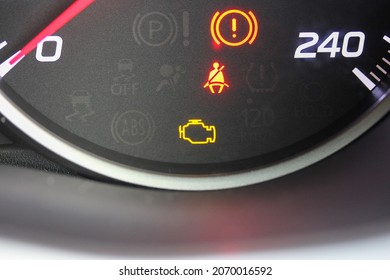Various warning lamps glowing in a new car speedometer