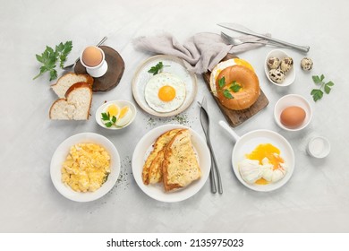 Various ways of cooking chicken eggs on light background. Breakfast food concept. Flat lay, top view, copy space