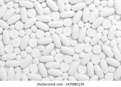 various white pills background, top view.