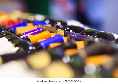 Various Wine Bottles In Row On Wooden Shelf. 