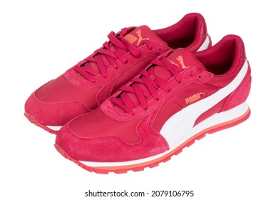 Varna , Bulgaria - APRIL 22, 2021. Red PUMA Sport Shoes, Isolated. Puma, A Major German Multinational Company. Product Shot