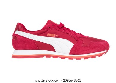 Varna , Bulgaria - APRIL 22, 2021. Red PUMA Sport Shoe, Isolated. Puma, A Major German Multinational Company. Product Shot