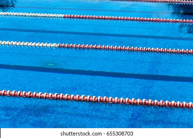 VARNA, BULGARIA - CIRCA 2017: Outdoor Sports Swimming Pool. Blue water and separation paths for swimmers athletes competitions in the Olympic sports swimming pool. Swimming pool for sports and fitness
