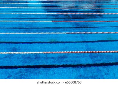 VARNA, BULGARIA - CIRCA 2017: Outdoor Sports Swimming Pool. Blue water and separation paths for swimmers athletes competitions in the Olympic sports swimming pool. Swimming pool for sports and fitness