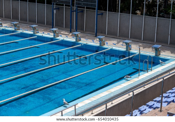 VARNA, BULGARIA -
CIRCA 2017: Sports swimming pool with dividing paths for
competition without swimmers. Cleaning the pool and preparing the
Olympic sports pool for
competitions