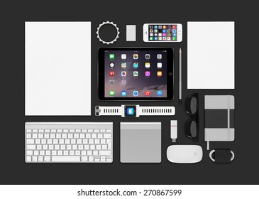 Varna, Bulgaria - February 10, 2015: Top View Of Apple Products Mockup. Consists Of Ipad Air 2, Iphone 5s, Keyboard, Smartwatch Concept, Notebook, Eraser, Bracelet, Reminder.