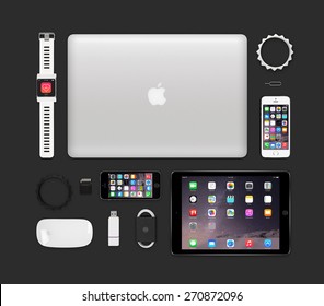 Varna, Bulgaria - February 11, 2015: Top View Of Apple Products Tech Mockup That Includes Retina Macbook Pro, Ipad Air 2, Smart Watch Concept, Iphone 5s, Magic Mouse, Flash Drive, Bracelets. 