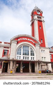 Varna, Bulgaria - July 17, 2014: Exterior of Varna railway station on a sunny day, ordinary people are near the entrance
