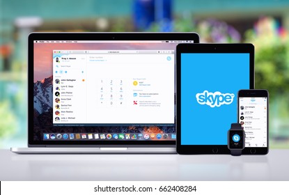 Varna, Bulgaria - May 23, 2017: Skype messenger on Apple MacBook Pro, splash screen with Skype logo on iPad Pro, Skype app on iPhone 7 and Skype notification icon on Apple Watch. Office desk concept.