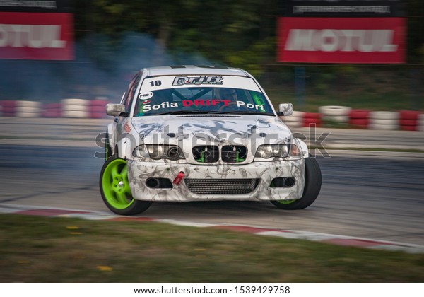 Varna, Bulgaria - October 14, 2018: Drift of\
Bulgaria. Challenge Battle BMW E46 Turbo with M power Engine. Full\
throttle drifting. Front view on one of the best drift cars ever. A\
lot of smoke