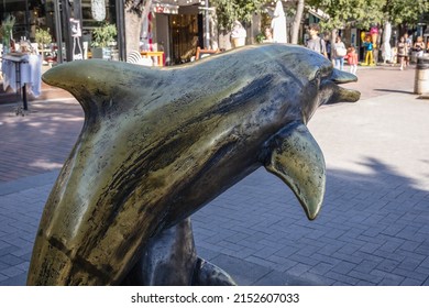 Varna, Bulgaria - September 3, 2021: Dolphin lovers sculpture on Slivnitsa Street in Varna