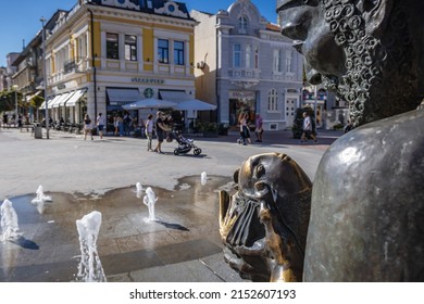 Varna, Bulgaria - September 3, 2021: Sculpture of fisherman and goldfish on Prince Boris I street in Varna city