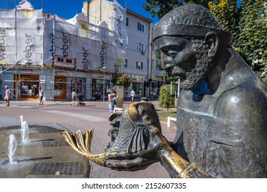 Varna, Bulgaria - September 3, 2021: Sculpture of fisherman and goldfish on Prince Boris I street in Varna