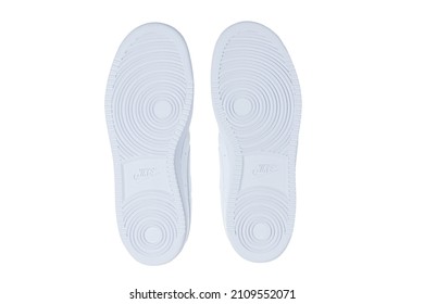 VARNA, BULGARIA-JULY 18, 2021: NIKE Renew Pair White Walking Sport Shoes Base View, On White Background