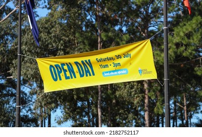 Varsity Lakes, Queensland, Australia. July 26, 2022. Bond University Open Day Signage And Flag At Main Entry