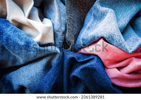Varuous shades and colors of denim fabrics. Denim texture background.