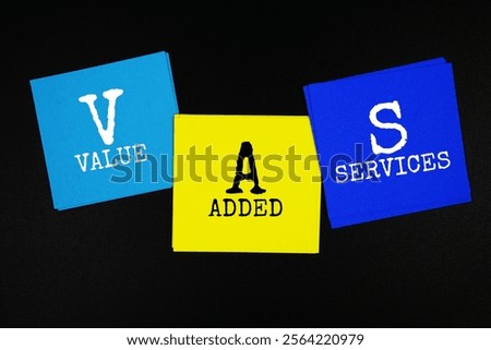 VAS - Value Added Services acronym text on sticky note on black background
