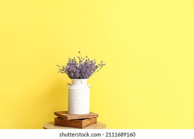 Vase With Beautiful Lavender Flowers On Table Against Color Background