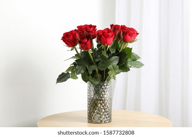 Vase With Bouquet Of Red Roses On Wooden Table, Space For Text