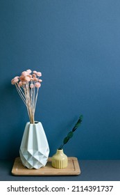 Vase Of Dry Flowers On Table. Navy Blue Wall Background. Home Interior Decor