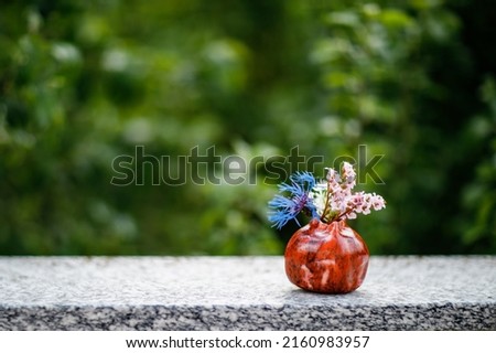 Vase with field flowers. Close-up of selfmade vase.. Colorful summer flower in garden