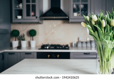 Vase Of White Tulips In A Modern Kitchen. Home Concept With Spring Flowers. 