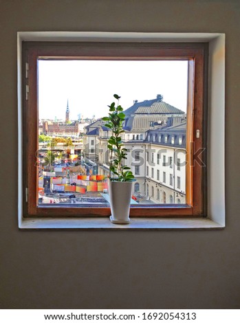 Vase and window. View through window on Railway station, Stockholm, Sweden