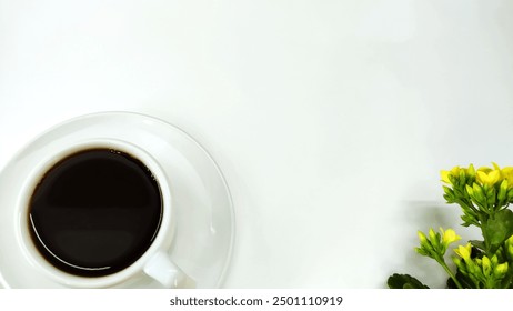 Vase of yellow Kalanchoe blossfeldiana Calandiva, houseplant and cup of coffee  on the white background background with copy space
 - Powered by Shutterstock