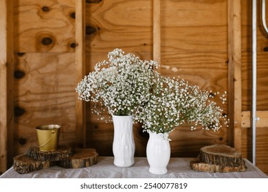 Vases With Delicate White Baby's Breath Flowers Displayed - Powered by Shutterstock