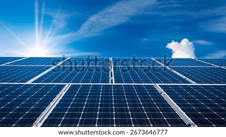 Vast array of solar panels at a power plant, absorbing sunlight under a blue sky to generate clean, renewable electricity for a sustainable future