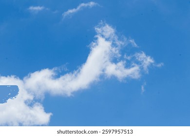 A vast blue sky with subtle cloud formations, providing a clean and refreshing natural aesthetic.