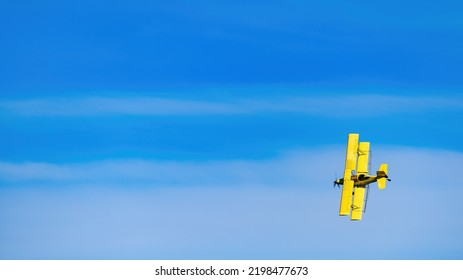 Vast Blue Sky And Yellow Crop Duster