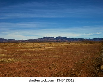 The vast emptiness of West Texas landscapes with a view of the mountains outside of Marfa Texas