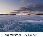 Vast ice surface of huge frozen Lake Laberge,  Yukon Territory, Canada, in April