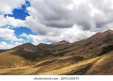 Vast mountain range under a cloudy sky with beautiful landscape