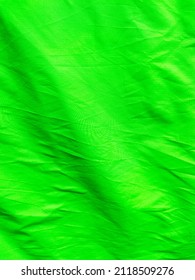 Vast view of green screen background. Used as negative space, backdrop, chroma key wallpaper, studio photo photography. Rimpled textiles cloth material. Chroma key objects - Shutterstock ID 2118509276