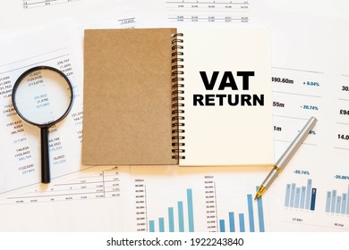 VAT RETURN - Financial Text On The First Page Of A Notebook, Against A Background Of Numbers And Charts