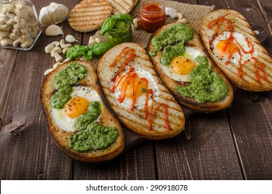 Vatiations Of Fried Eggs Inside Bread, Panini Bread With Pesto And Hot Sriracha Sauce