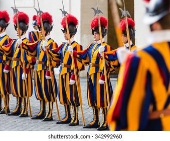 VATICAN CITY, VATICAN - Nov 20, 2015: Papal Swiss Guard in uniform. Currently, the name Swiss Guard generally refers to the Pontifical Swiss Guard of the Holy See stationed at the Vatican in Rome