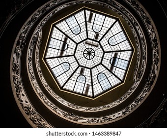 Vatican City, Rome - July 13th 2015: View looking up at the octagonal skylight above the double helix Bramante spiral staircase in the Vatican Museums (Pio-Clementine Museum) designed by Giuseppe Momo