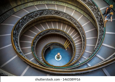 Vatican City, Rome - July 13th 2015: The modern double helix Bramante spiral staircase in the Vatican Museums (Pio-Clementine Museum), designed by Giuseppe Momo in 1932