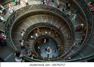 VATICAN CITY, VATICAN STATE - SEPTEMBER 27, 2015: People descend the modern double helix staircase designed by Giuseppe Momo in 1932, Vatican Museums