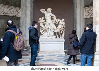 VATICAN, ITALY - DECEMBER 17, 2010: visitors near Laocoon and His Sons (Laocoon Group) sculpture in Gallery of Statues, open loggia of Pio-Clementino Museum in Vatican museums in Vatican city