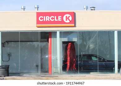 Vaughan, Ontario Canada - Jan 23, 2021: Black Car Getting Wash Inside Esso Gas Station Car Wash With Inside Circle K Convenience Store At Jane And Major Mackenzie Drive, Vaughan.