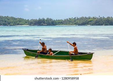 Vavau Island, Tonga - Jan 1 2014: Three Local Native Indigenous Polynesian Boys Rowing In A Canoe, Vava'u (Vavaʻu) Island, Tonga, Polynesia, Oceania, South Pacific Ocean.