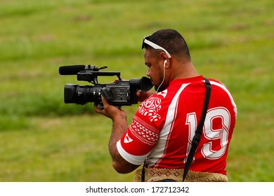 VAVAU, TONGA - NOVEMBER 17: Unidentified Man Takes Video Of Fuifui Moimoi At His Arrival On November 17, 2013 In Tonga. Fuifui Is Tonga International Representative Forward In Rugby League.