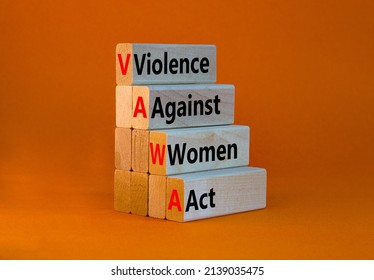 VAWA Violence Against Women Act Symbol. Concept Words VAWA Violence Against Women Act On Blocks. Beautiful Orange Background. Business, Motivational VAWA Violence Against Women Act Concept.