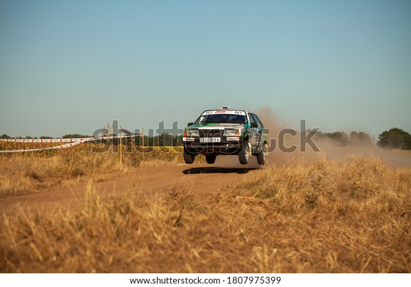 VAZ rally car jumping in motion with clouds of\
dust during 4th stage of the Ukrainian Championship in mini-rally\
\
