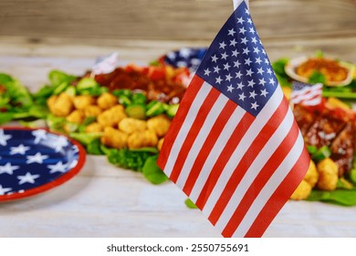 Vbrant display of festive foods includes American flag displayed prominently, celebrating Independence Day with classic treats and decorative elements. - Powered by Shutterstock