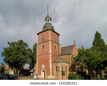 Vechta, Germany - October 03, 2019: provost church St. Georg in sunshine against vivid grey sky